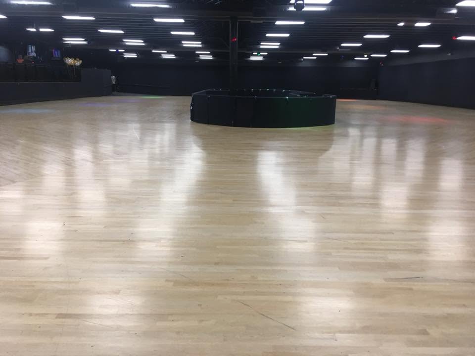 The maple floor and DJ booth at World on Wheels roller rink